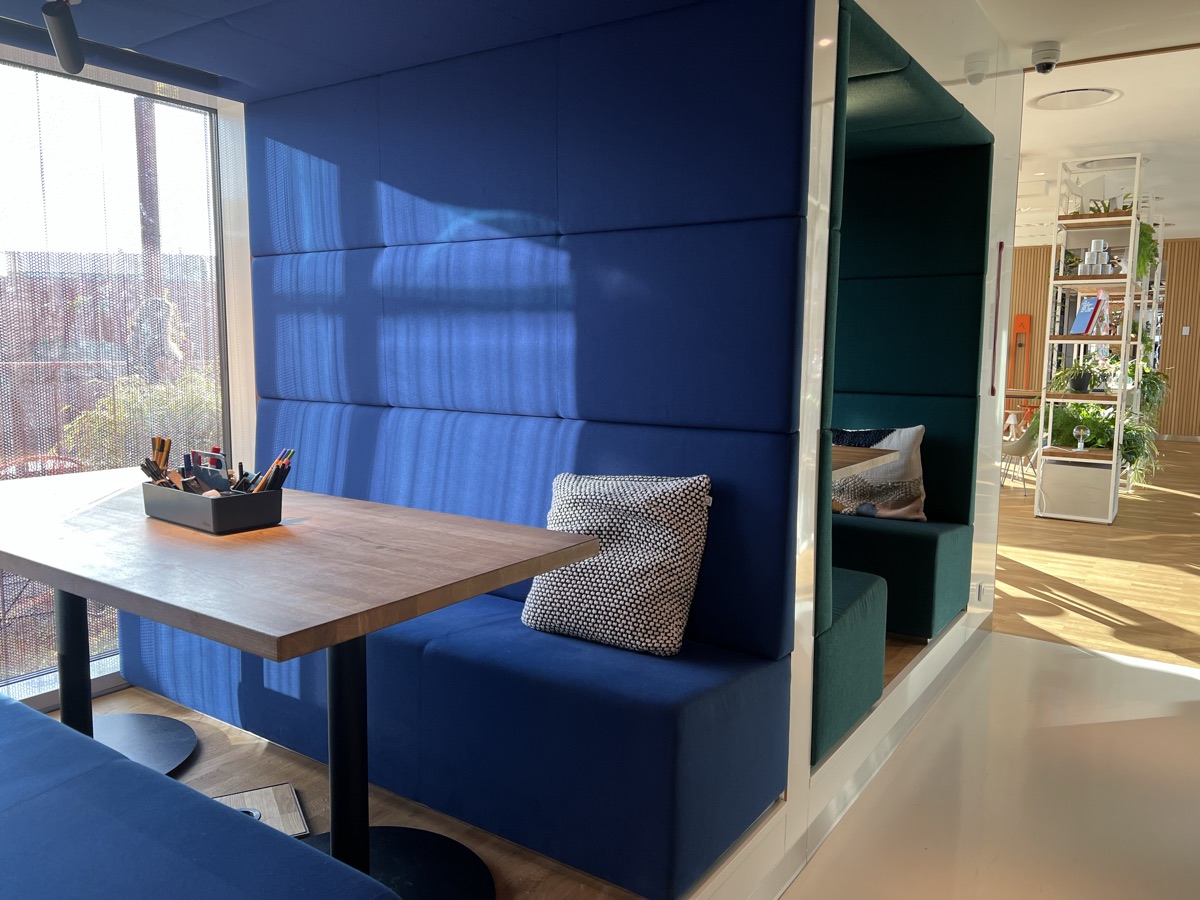 A quiet booth with a table by the window